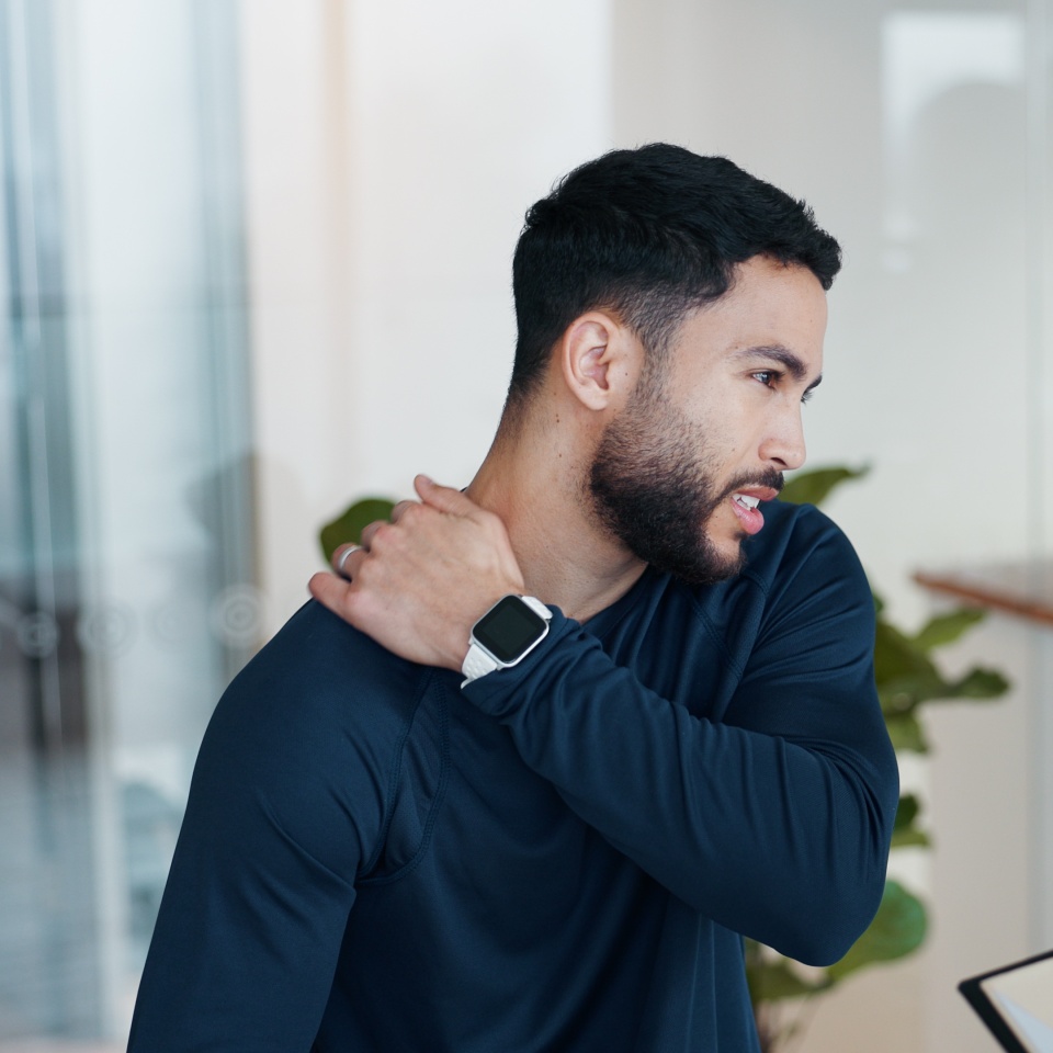 Physiotherapy, clipboard and shoulder pain with people in clinic for rehabilitation, healthcare or symptoms. Support, medical and chiropractor with man and athlete exam for healing, advice or report.