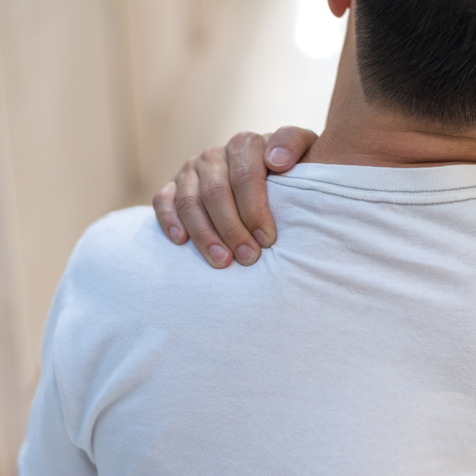 Man with hand squeeze at red spot shoulder as suffering from pain or itchy. Male hurt at shoulder and neck as sick from psoriasis,Thoracic Outlet Syndromes, Rotator Cuff Injury,Bursitis,Fibromyalgia