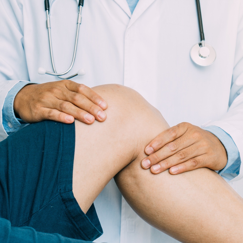 Physiotherapist treating with patient about elbow pain problems.Physical therapy concept