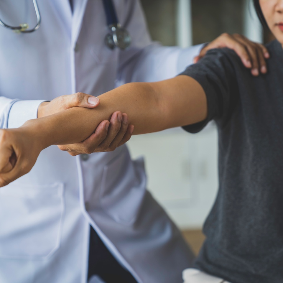 The doctor counsels the patient about pain in the muscles of the arms and elbows. office syndrome problem physical therapy diagnostic concept