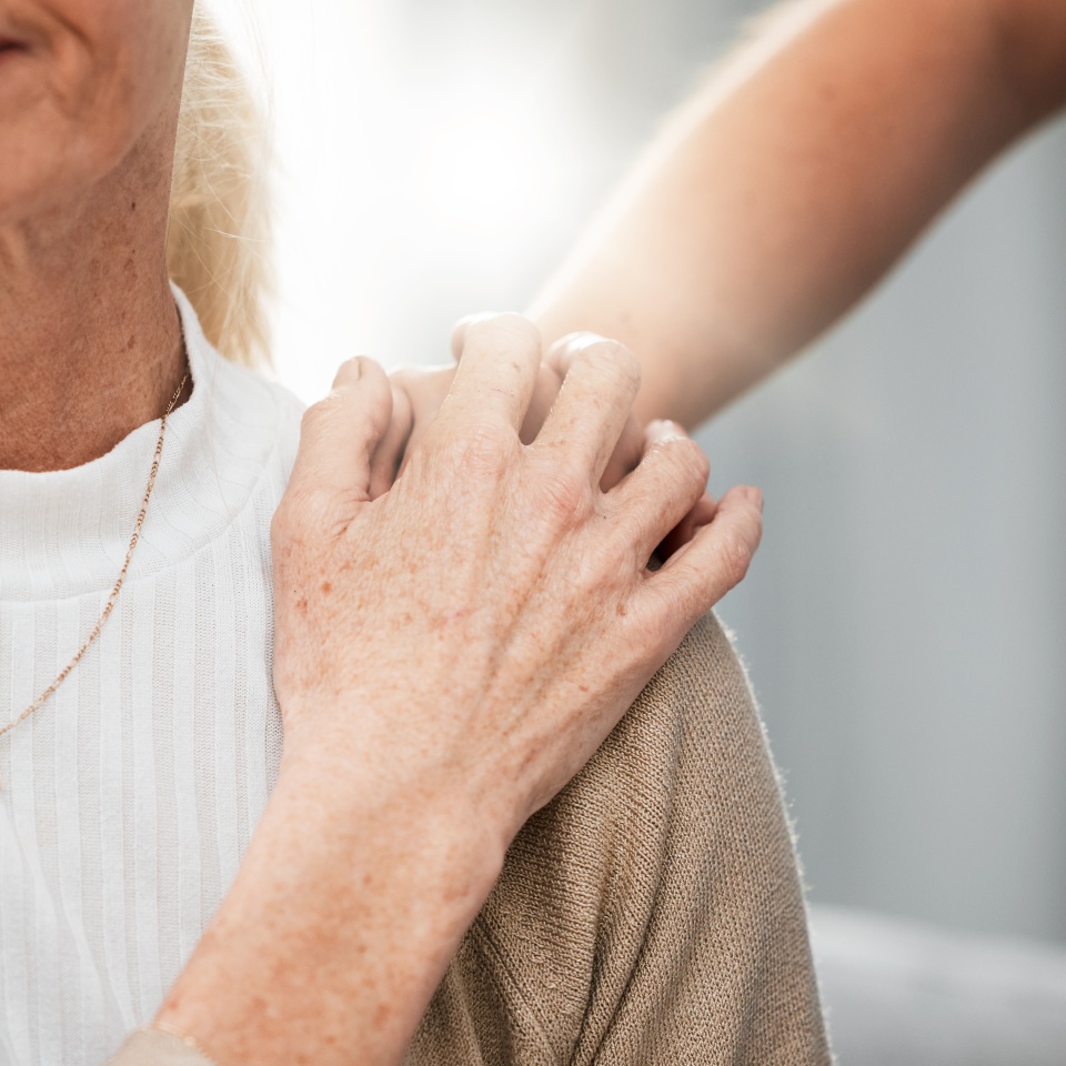 Shoulder, old woman or nurse holding hands in hospital consulting about medical test news or results for support. Empathy, hope or doctor in healthcare clinic nursing or helping sick elderly patient.