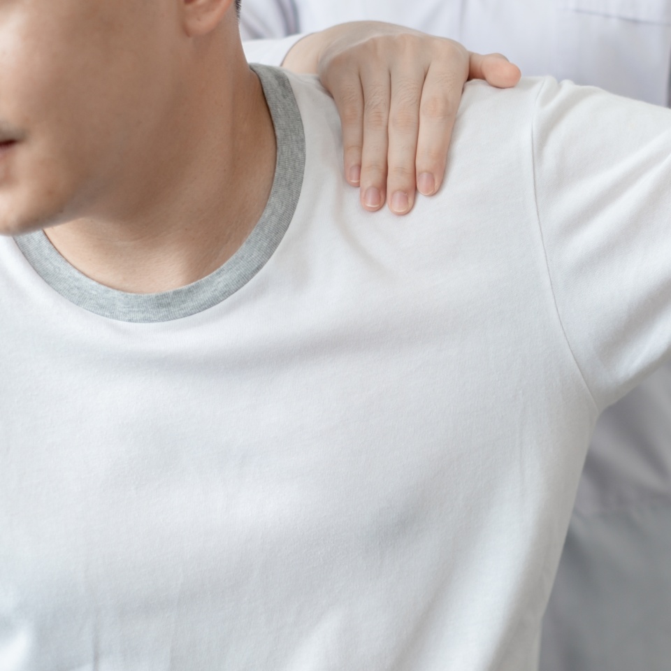 Therapist treating injured back of male patient, Physical therapy concept.