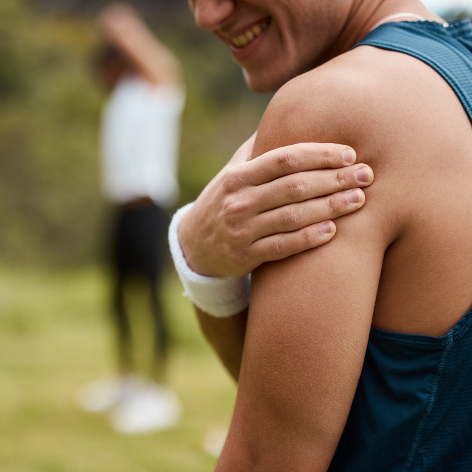 Sports man, nature and shoulder pain from workout training injury or fitness cardio running accident outdoor. Hand, arm muscle or closeup of athlete runner with exercise elbow emergency in park.